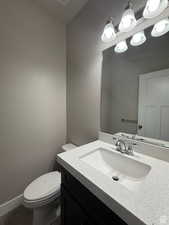 Bathroom featuring vanity and toilet