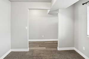 Spare room featuring carpet floors and a textured ceiling