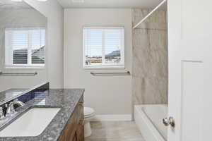 Full bathroom with vanity and shower / washtub combination