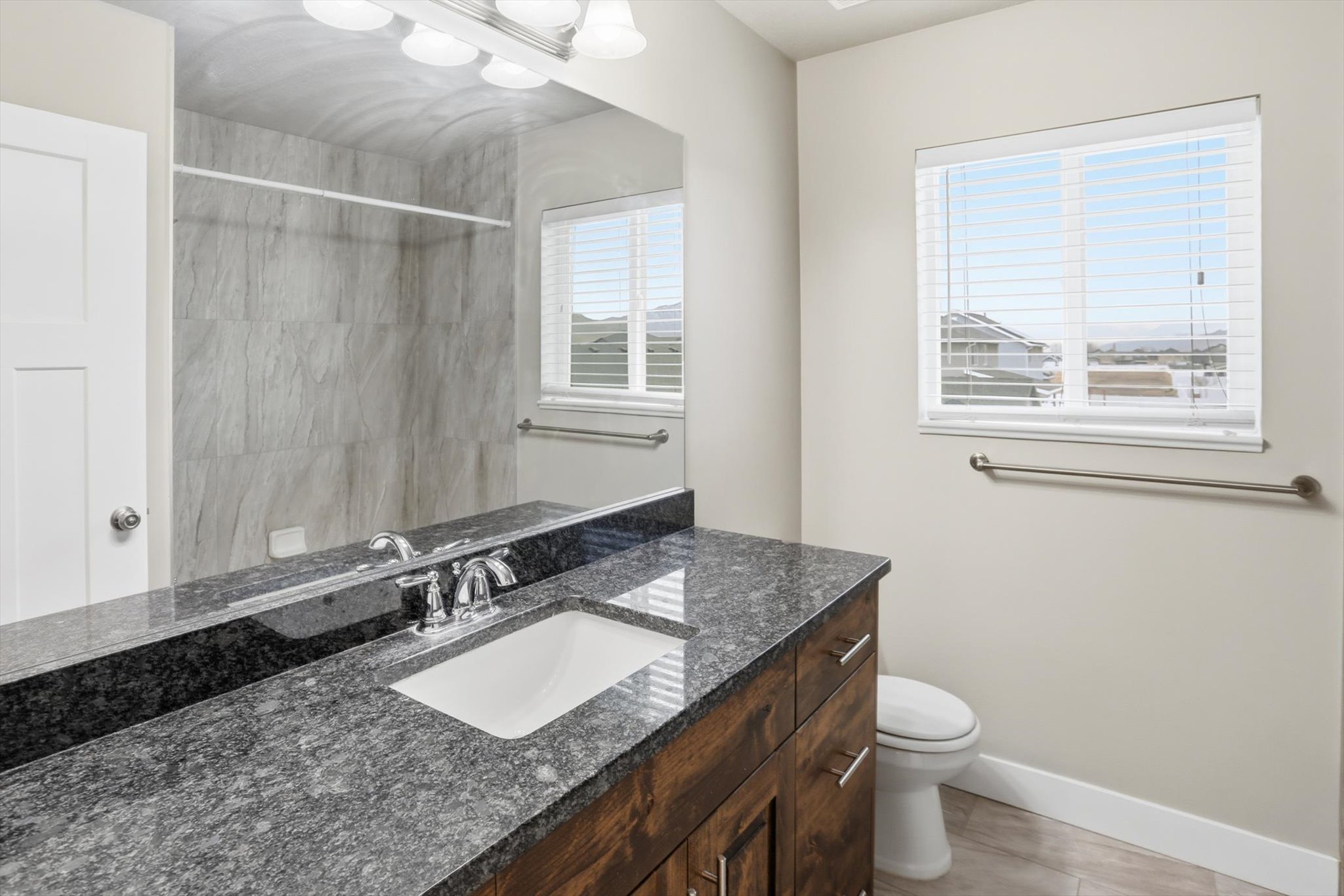 Bathroom with vanity and a shower