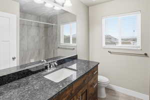 Bathroom with vanity and a shower