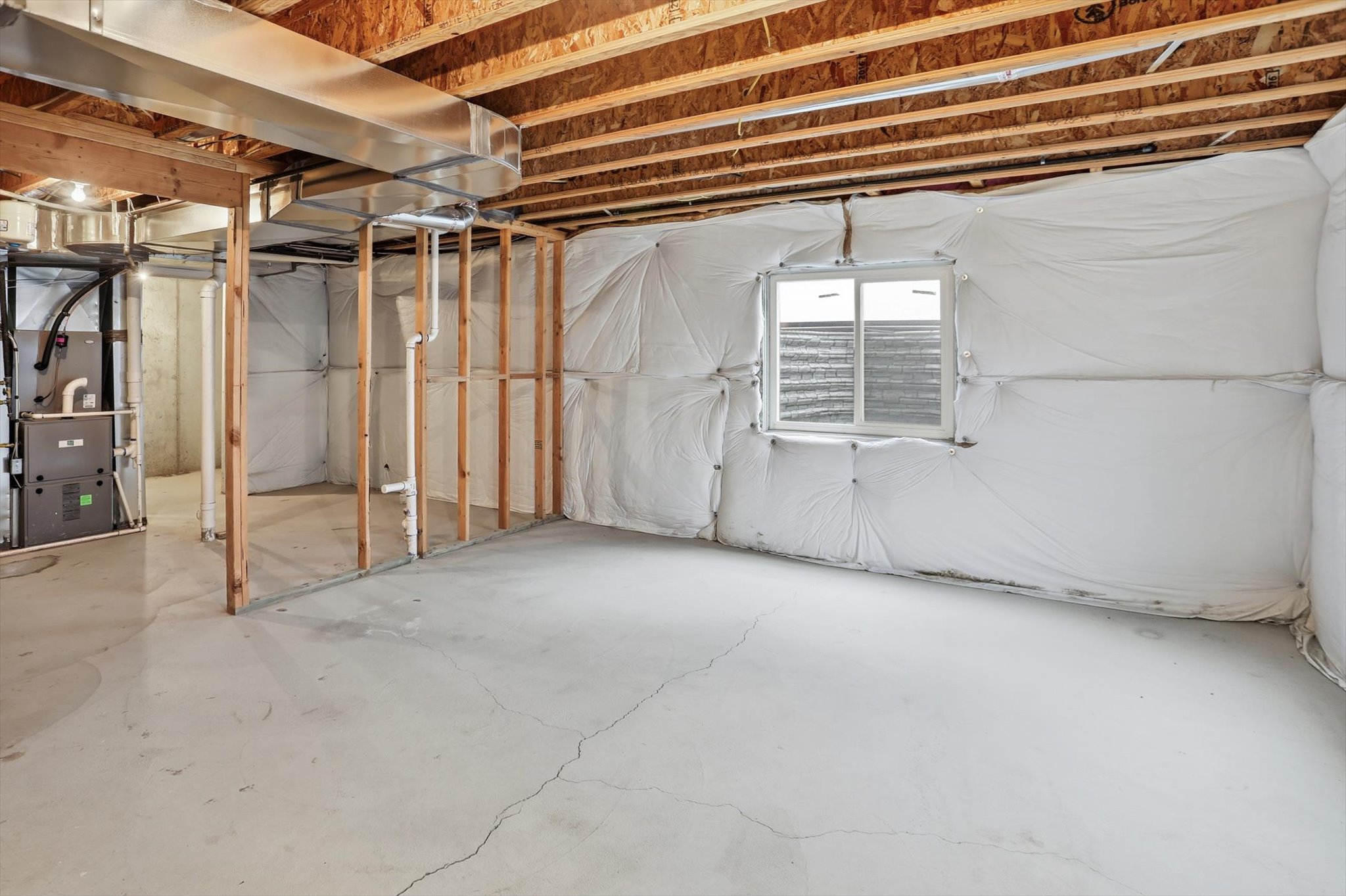 Below grade area featuring heating unit