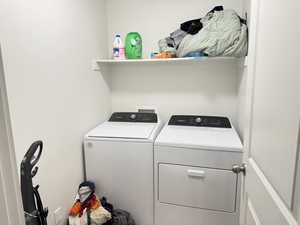 Laundry area featuring separate washer and dryer