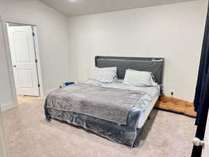 Bedroom with light colored carpet
