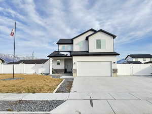 View of front of home featuring a gate, an attached garage, driveway, a porch, and stucco siding