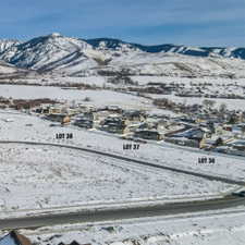 View of mountain background featuring nearby suburban area