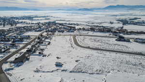 Snowy aerial view with a mountain view