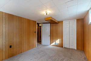 Unfurnished bedroom featuring carpet flooring and a closet