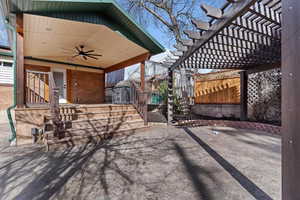View of patio featuring ceiling fan