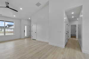 Entryway with a ceiling fan, light wood-type flooring, and recessed lighting