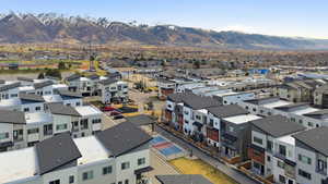 Aerial perspective of suburban area featuring a mountain backdrop