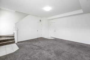 Empty room featuring carpet flooring