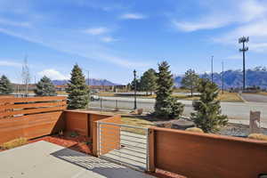 View of patio / terrace featuring a mountain view and a gate