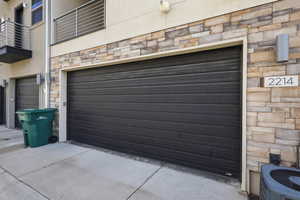 Garage featuring concrete driveway