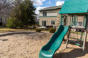 Community playground with a patio area