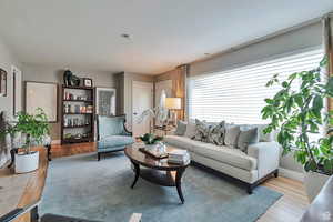 Living room featuring baseboards and wood finished floors