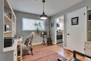 Office area featuring healthy amount of natural light and light wood-style floors