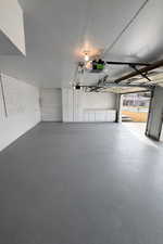 Garage featuring a garage door opener