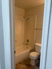 Bathroom with toilet and washtub / shower combination