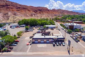 Aerial view of a mountainous background and a commercial area