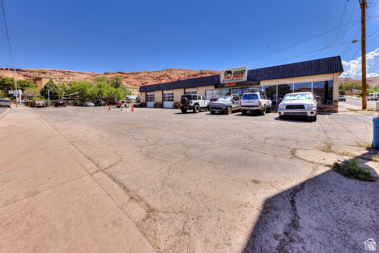 Uncovered parking lot featuring a mountain view