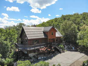 View of front of property featuring a deck and a chimney
