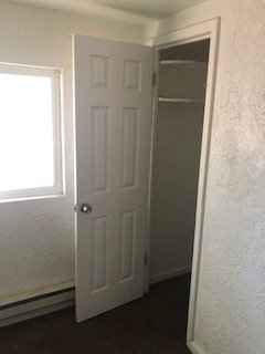 Closet with baseboard heating