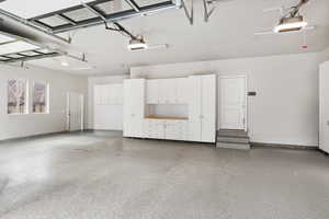 Garage featuring a garage door opener