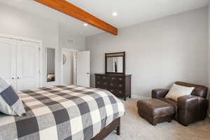 Bedroom featuring recessed lighting, light carpet, a closet, and beamed ceiling