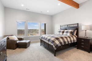 Bedroom with light colored carpet, recessed lighting, and beamed ceiling