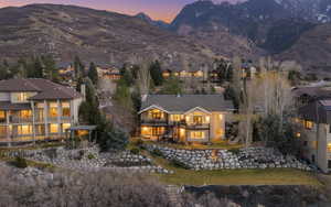 Rear view of house with a balcony and a mountain view