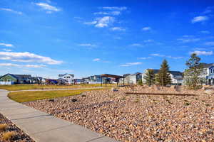 View of grassy yard featuring a residential view