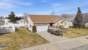Ranch-style home with concrete driveway, roof with shingles, an attached garage, and brick siding