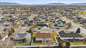 Aerial view of residential area featuring a mountain backdrop