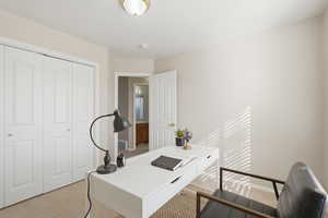 Office with light colored carpet