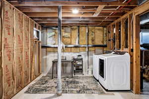 Basement with washing machine and clothes dryer