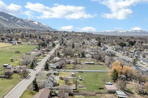 Aerial perspective of suburban area with a mountain backdrop
