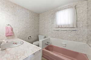 Bathroom featuring vanity and a garden tub