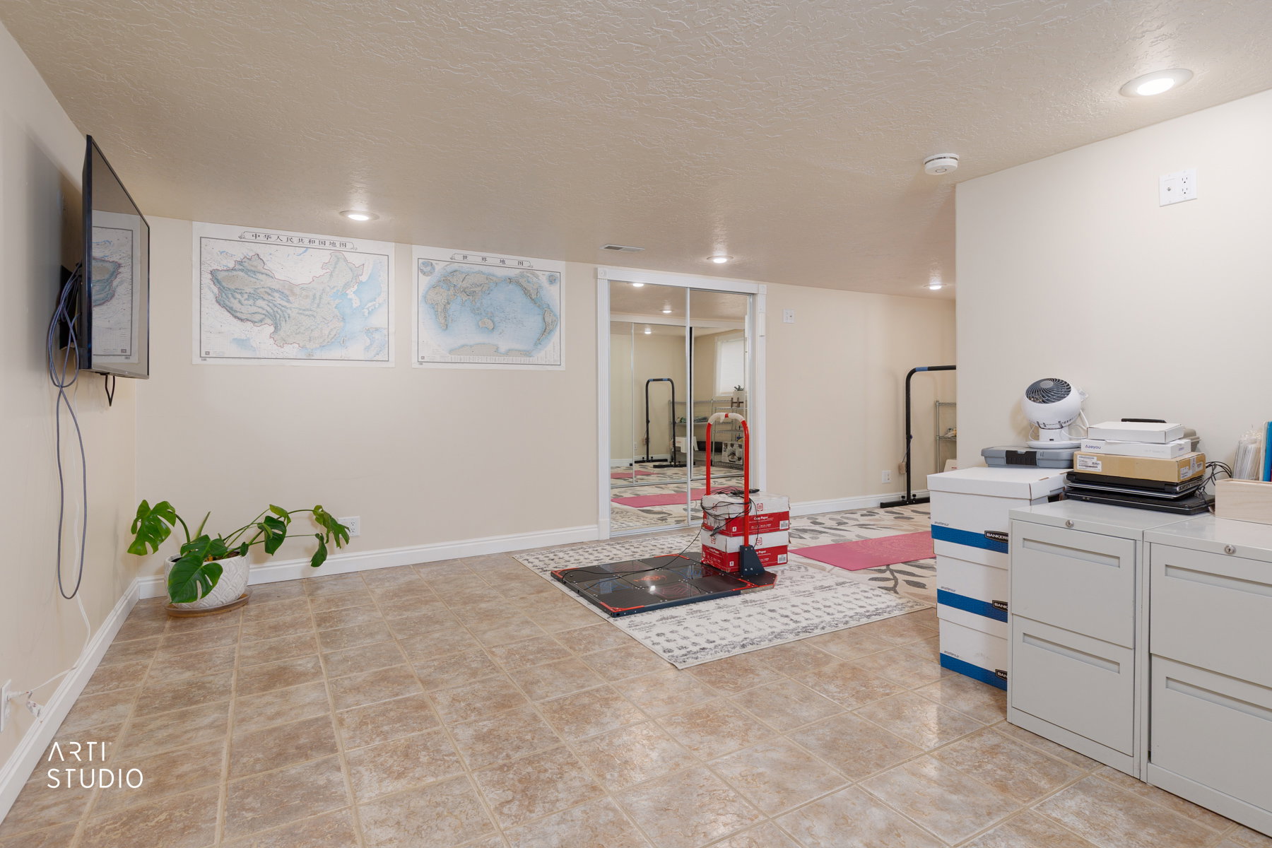 Game room with a textured ceiling, recessed lighting, and light tile patterned floors