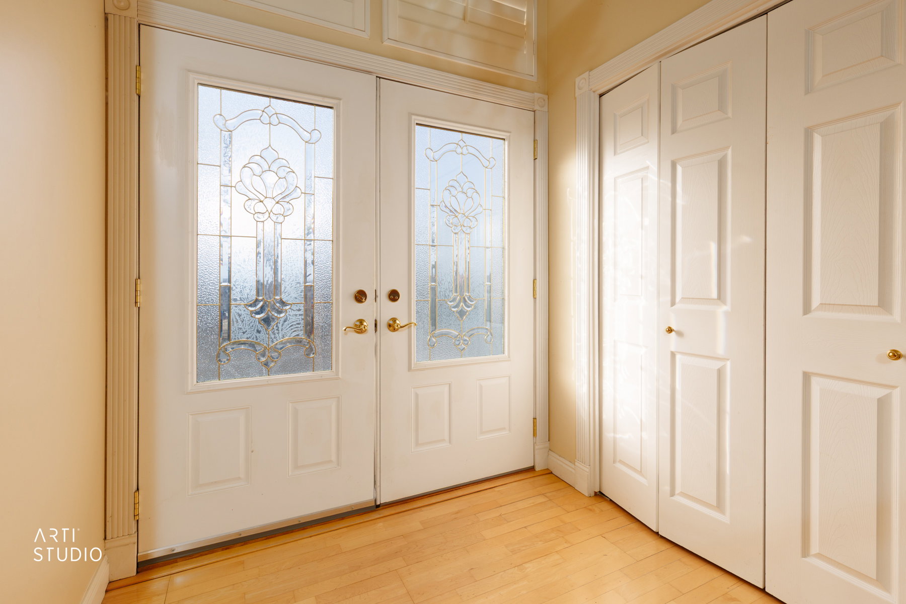 Entryway featuring french doors and light wood-type flooring
