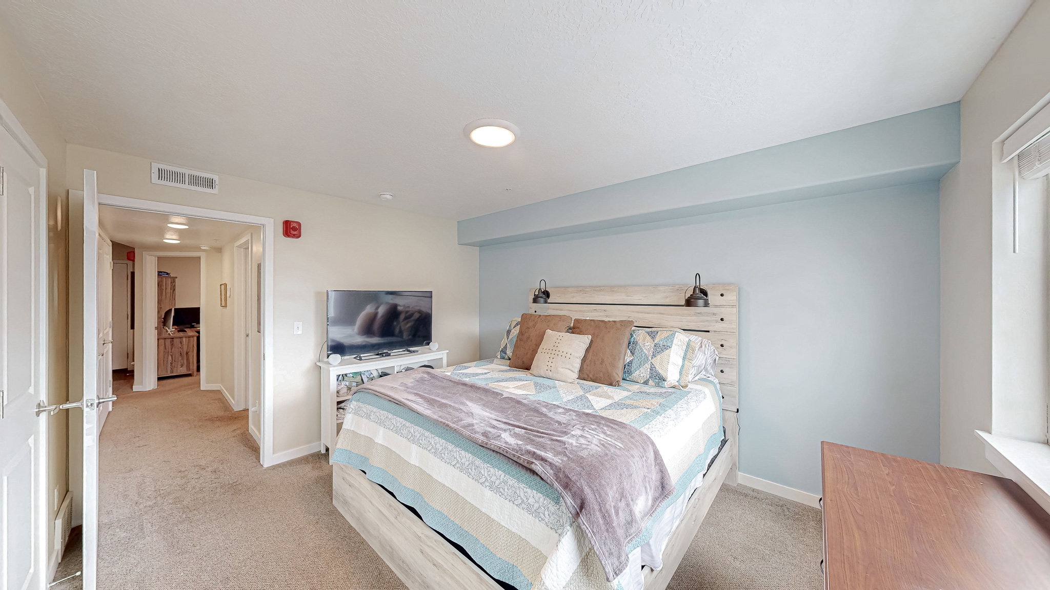 Bedroom with light carpet