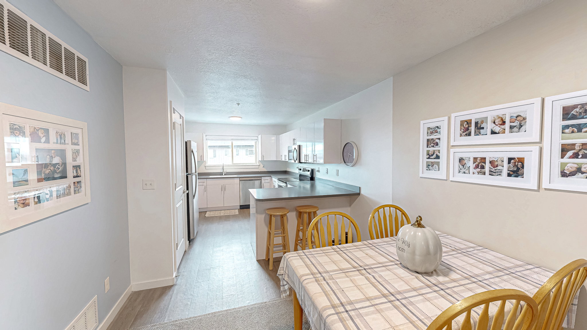 Dining room featuring a textured ceiling and baseboards