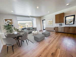 ADU Living room featuring light wood-style flooring and recessed lighting