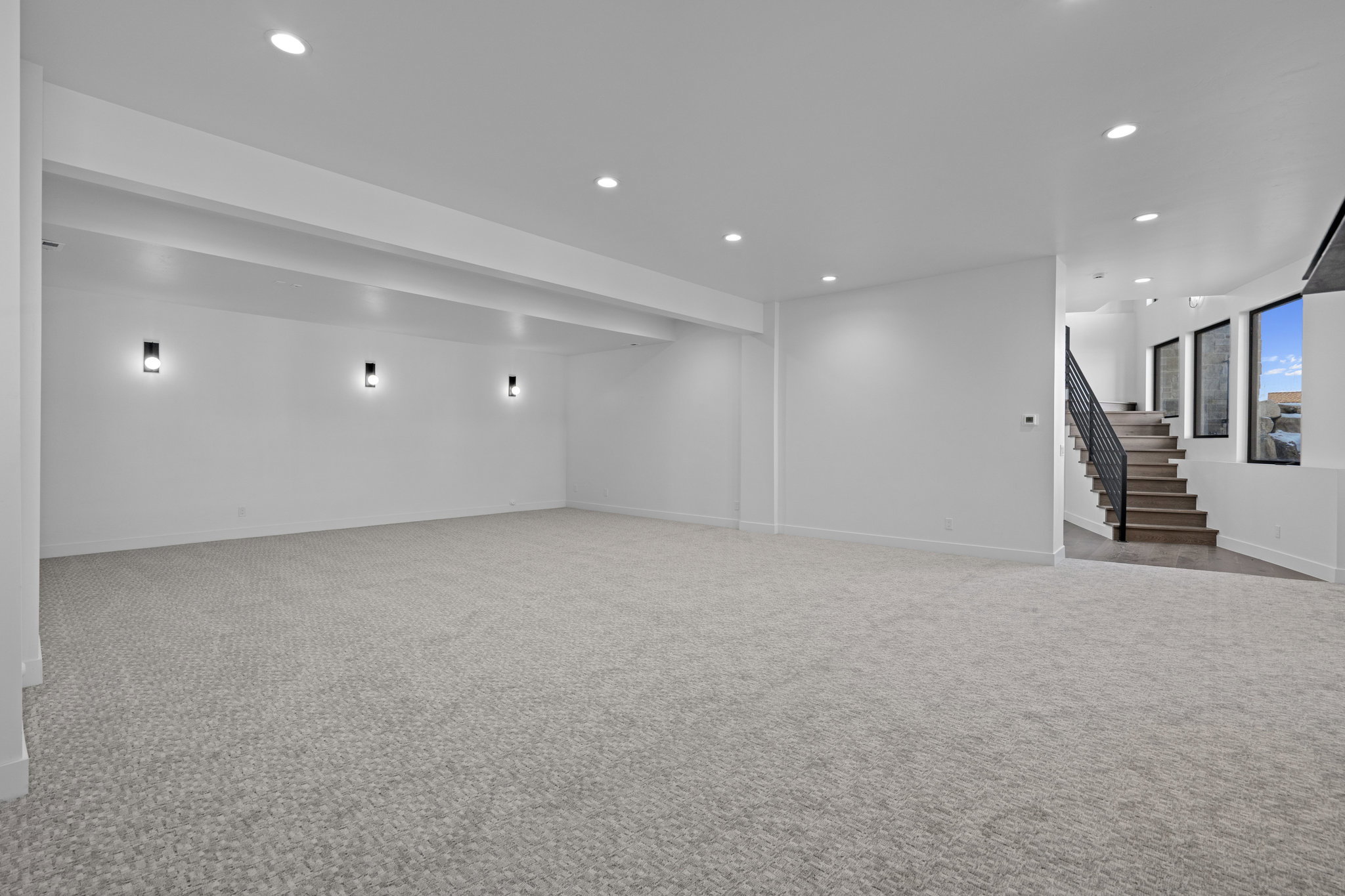 Finished lower level featuring light carpet and recessed lighting