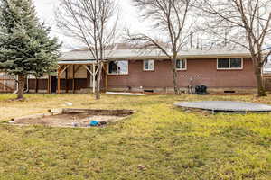 Rear view of property with brick exterior