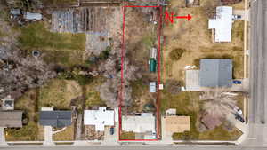Aerial view of residential area featuring property boundaries highlighted