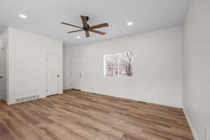 Unfurnished bedroom with light wood-style flooring, ceiling fan, and recessed lighting