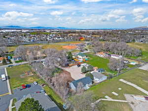 Aerial overview of property's location with nearby suburban area and a mountain backdrop