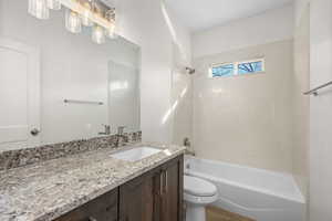 Bathroom with vanity and shower / bath combination
