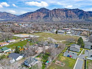 View of property location featuring a mountain backdrop and nearby suburban area